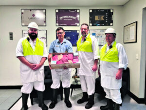Two lucky winners take home a swag of meat in Anzac Day raffle