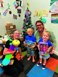 Families from Amberley OSHC assist with a toy run for DVAC