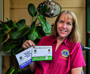 The booklet lady and the Rosewood Lions medi-alert project
