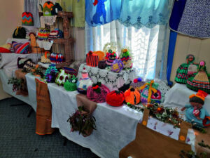 Colourful display of tea cosies and aprons